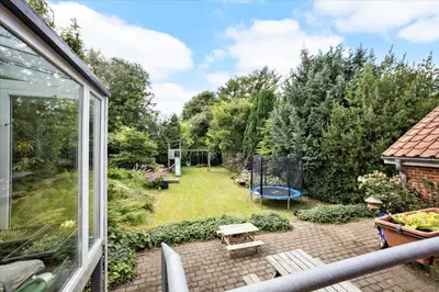 a garden with a picnic table and a playground at Cozy House Close to Beach and B&O in Struer