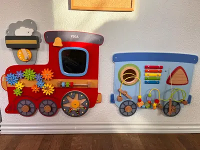 a toy train on a wall in a room at Cozy House Close to Beach and B&O in Struer
