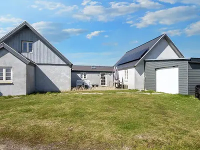 a house with a large yard in front of it at 10 person holiday home in Harboøre-By Traum in Harboør