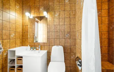 a bathroom with a white sink and a mirror at Awesome Home In Thyborøn With Wifi in Thyborøn