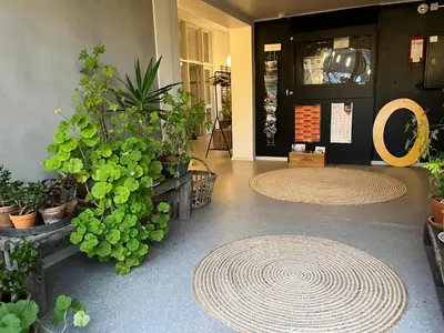 a lobby with a bunch of potted plants at Room 8 - Hawkraft kulturhotel in Vestervig