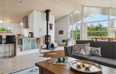 a living room with a couch and a table at Pet Friendly Home In Saltum With Wifi in Saltum