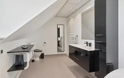 a bathroom with a sink and a toilet at Beautiful Home In Farsø With Kitchen in Farsø