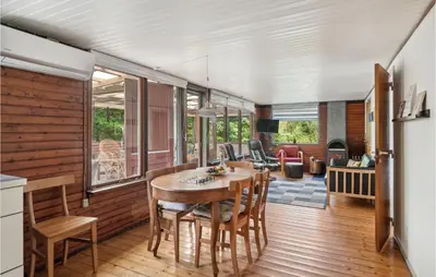 a kitchen and dining room with a table and chairs at Beautiful Home In Struer With Kitchen in Struer