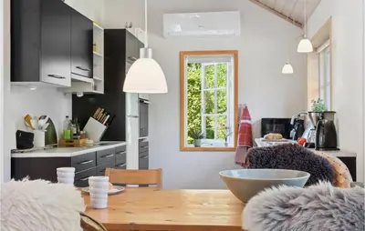 a kitchen with a wooden table and a dining room at Stunning Home In Fur With Wifi in Fur