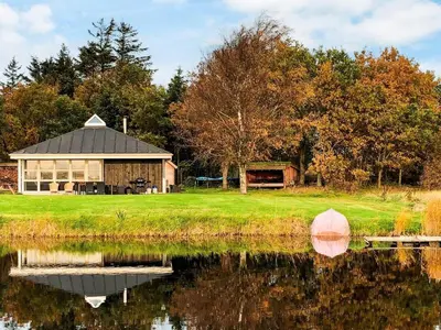 a building next to a body of water at 4 person holiday home in Thisted-By Traum in Thisted