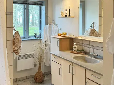 a bathroom with a sink and a window at 8 person holiday home in Thyholm-By Traum in Thyholm