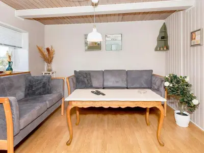 a living room with a couch and a table at 5 person holiday home in Karby-By Traum in Karby