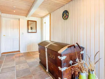 an old trunk sitting on the floor of a room at 5 person holiday home in Karby-By Traum in Karby