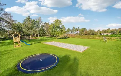 a playground with a frisbee in the grass at Lovely Home In Højslev With Sauna in Højslev