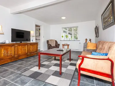 a living room with a couch and a table at 6 person holiday home in Thisted-By Traum in Thisted