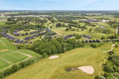 an aerial view of the golf course at the resort at Nice holiday home in beautiful resort in Farsø