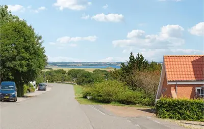 a street with cars parked on the side of a road at Beautiful Apartment In Hurup Thy in Heltborg