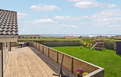 a deck with a playground on a house at Stunning Home In Vinderup With Kitchen in Vinderup