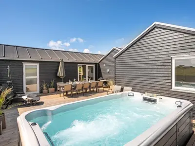 a swimming pool in the backyard of a house at Holiday Home Ivar - 300m from the sea by Interhome in Harboør