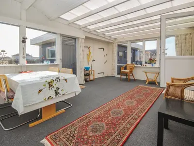 a large room with a bed and a rug at Holiday Home Hilmer - 250m from the sea by Interhome in Torsted