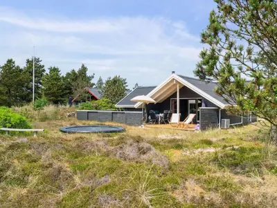 a small house in the middle of a field at Holiday Home Myrte - 900m from the sea by Interhome in Torsted