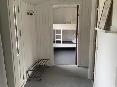 a hallway with a room with a bunk bed at Holiday Home Bjerne - 250m to the fjord by Interhome in Roslev