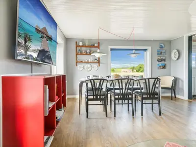 a dining room with a table and chairs at Holiday Home Swaantje - 150m to the fjord by Interhome in Fur