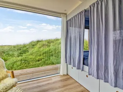 a room with a window with a view of the ocean at Holiday Home Hoat - 300m from the sea by Interhome in Saltum