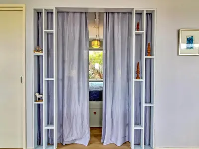 a room with two windows with white curtains at Holiday Home Hoat - 300m from the sea by Interhome in Saltum