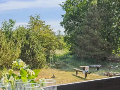 a view of a garden with a picnic table at Holiday Home Nadia - 300m to the fjord by Interhome in Fur