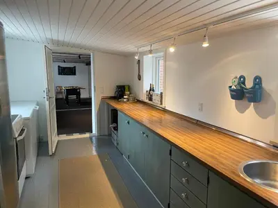 a kitchen with a counter top and a sink at Thyholm B&B in Thyholm
