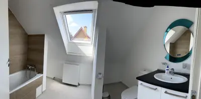 a white bathroom with a sink and a window at Apartment Vanilla - 2 rooms and one bathroom in Struer