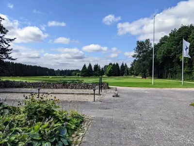 a park with a flag and a golf course at 6 person holiday home in Skals-By Traum in Skals