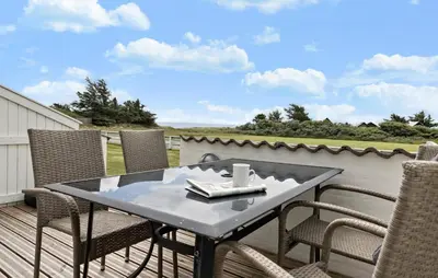 a table and chairs on a deck with a view at Stunning Home In Vestervig With Kitchen in Vestervig