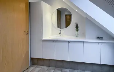 a bathroom with a sink and a mirror at Beautiful Home In Nykøbing M With Wifi in Nykøbing Mors
