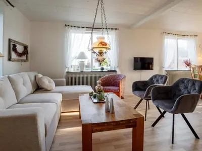 a living room with a couch and chairs and a table at 8 person holiday home in Lemvig-By Traum in Lemvig