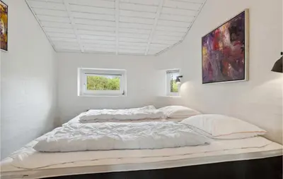 a white bedroom with a large bed and a window at Pet Friendly Home In Thisted With Wifi in Thisted