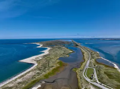an aerial view of an island in the ocean at Agger Beach Apartment in Vestervig