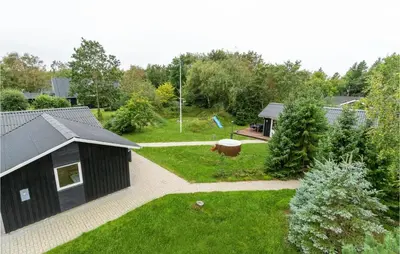 an aerial view of a garden with a black house at Nice Home In Thyholm With Wifi in Thyholm