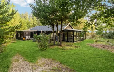 a cabin in the middle of a yard at 2 Bedroom Gorgeous Home In Højslev in Højslev