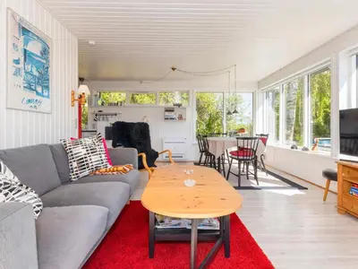 a living room with a couch and a table at 6 person holiday home in Nykøbing M-By Traum in Alsted