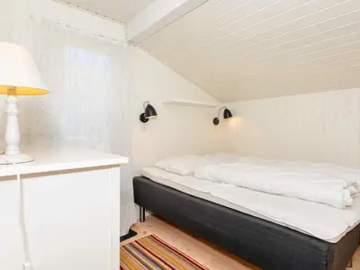 a bedroom with a bed in a room at 6 person holiday home in Nykøbing M-By Traum in Alsted