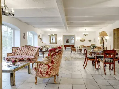 a living room with furniture and a dining room at 5 star holiday home in Spøttrup-By Traum in Spottrup