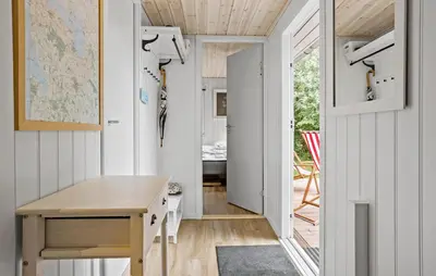 a home office with a desk and a table at 3 Bedroom Nice Home In Thyholm in Thyholm