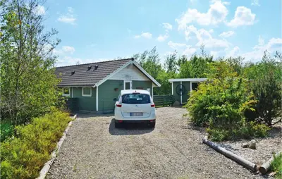 a white car parked in front of a house at Nice Home In Vinderup With Kitchen in Vinderup