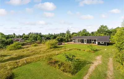 a house in the middle of a field at Holiday Home Højslev 42 in Højslev