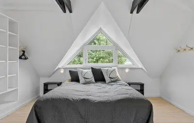 a bedroom with a bed and a large window at Stunning Home In Hurup Thy With Wifi in Boddum