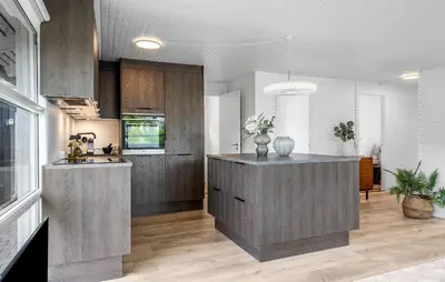 a kitchen with gray cabinets and a kitchen island at Cozy Home In Løgstrup With Wifi in Løgstrup