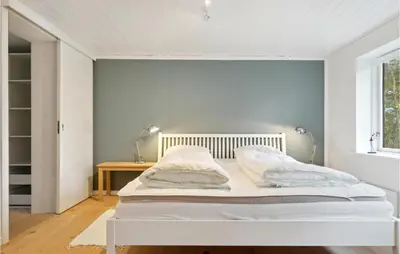 a white bed in a room with a window at 2 Bedroom Cozy Home In Fjerritslev in Fjerritslev