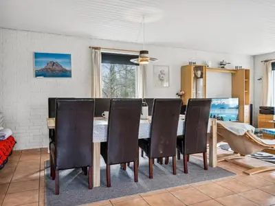 a dining room with a table and chairs at Holiday Home Patrik - 200m to the fjord by Interhome in Fur