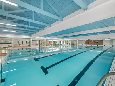 a large swimming pool with blue water at Apartment Alvy - 100m to the fjord by Interhome in Lemvig
