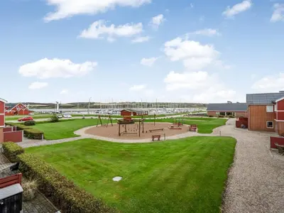 a park with a playground in the middle of a field at Apartment Alvy - 100m to the fjord by Interhome in Lemvig