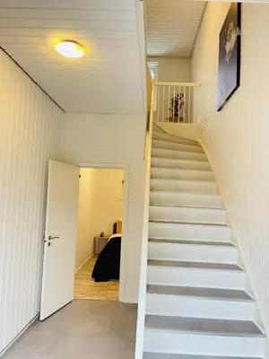 a staircase leading to the basement of a house at aday - Modern 3 bedrooms apartment in Svenstrup in Svenstrup
