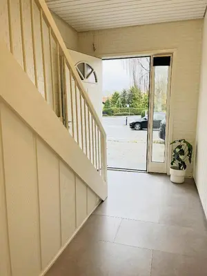an open door to a house with a potted plant at aday - Modern 3 bedrooms apartment in Svenstrup in Svenstrup